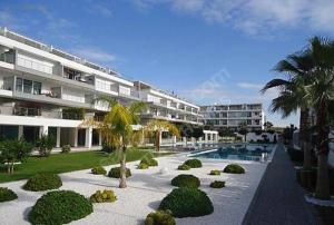 a building with a garden and a resort at Manavgat - Superb 2 bedroom apartment near beach and Side centre in Side