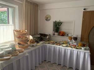 a table with a buffet of food on it at Piast in Karwia