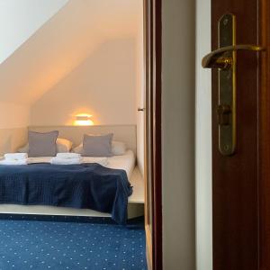 Postel nebo postele na pokoji v ubytování Hotel Gabreta