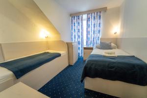 Postel nebo postele na pokoji v ubytování Hotel Gabreta