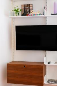 TV o dispositivi per l'intrattenimento presso Mecenate Suite Colosseum
