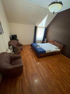 Postel nebo postele na pokoji v ubytování Отель Ренессанс