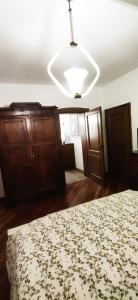 a bedroom with a bed and a white ceiling at Villa Mazzini in Molinella