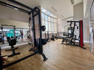a gym with several treadmills and machines in a room at Flat Lindo ao lado Park Ibirapuera Av Paulista com garagem 103 in Sao Paulo