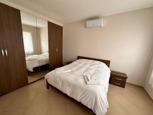 Voodi või voodid majutusasutuse Cliff Side Apartment toas