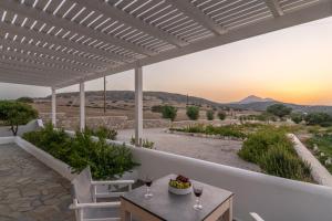 a view from the patio of a house with a table and chairs at Loulou House in Agia Kiriaki Beach
