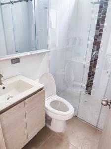 a bathroom with a toilet and a sink and a shower at Paradise in Envigado- in Envigado