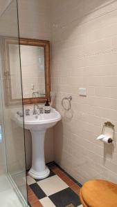 a bathroom with a sink and a mirror at The Bank House in Mount Victoria +42 photos