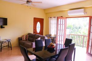 a living room with a couch and a table at Hidden Gem Apartments (No.5) in Castries