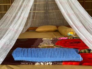 Кровать или кровати в номере INDOS HOMESTAY