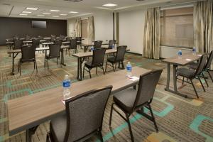 a conference room with tables and chairs and water bottles at Residence Inn by Marriott Tyler in Tyler