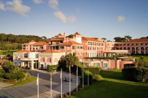 a large building with a street in front of it at Penha Longa Resort in Sintra
