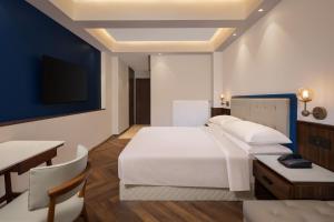 Four Points by Sheraton Sonmarg Resort客房内的一张或多张床位