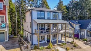 an exterior view of a house with a wrap around porch at After Dune Delight in Lincoln City