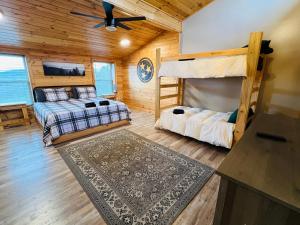 a bedroom with two bunk beds and a rug at Dolly's Lodge # 3 condo in Sevierville
