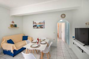 a living room with a couch and a table at Militsa House in Gaios