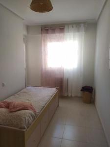 a bedroom with a large bed and a window at TXIMELETA Haro in Haro