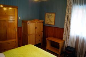 Postel nebo postele na pokoji v ubytování Tradicion Austral Bed & Breakfast
