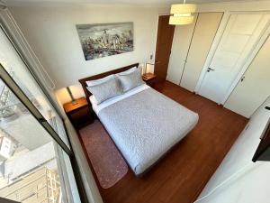 En eller flere senge i et værelse på Private apartment in Santiago