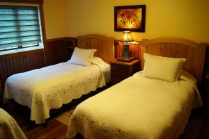 Postel nebo postele na pokoji v ubytování Tradicion Austral Bed & Breakfast