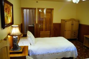 Postel nebo postele na pokoji v ubytování Tradicion Austral Bed & Breakfast