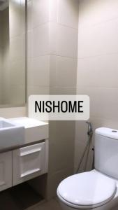 een badkamer met een wit toilet en een wastafel bij Homestay Murah Icity Shah Alam Duplex in Shah Alam