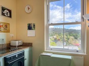 a kitchen with a window with a view at Rock Terrace View in Bakewell