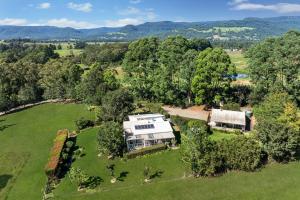 an aerial view of a house in a field at Wild Rose Cottage Kiaroo Estate, Kangaroo Valley in Kangaroo Valley