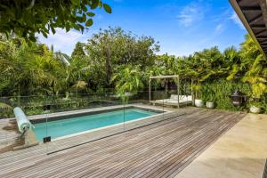 an image of a swimming pool in a house at Grey Lynn Luxury 4BD Villa w Pool Free Parking in Auckland