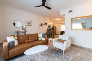 a living room with a couch and a chair at Luxury 2BD 2BTH Condo 5 in Cocoa Beach