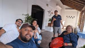 a group of people sitting in a living room at Hostal ROCA INN in Mazatlán