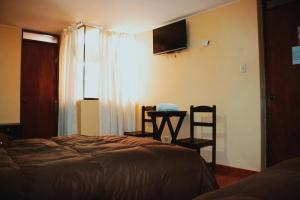Postelja oz. postelje v sobi nastanitve Pachamama Hostel