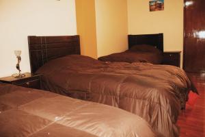 Postelja oz. postelje v sobi nastanitve Pachamama Hostel