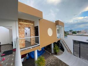 a balcony of a house with a slide at Un departamento a tu gusto in Valladolid