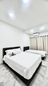 Ένα ή περισσότερα κρεβάτια σε δωμάτιο στο 27Jun +1 φωτογραφίες