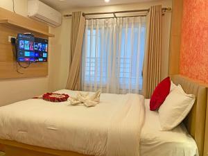 Letto o letti in una camera di Hotel Malati