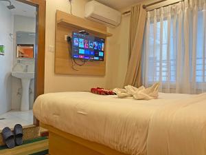 Letto o letti in una camera di Hotel Malati