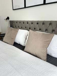 a bedroom with a bed with two pillows on it at Voyage in Kehl am Rhein