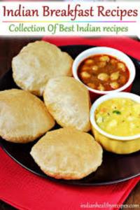 a plate of food with biscuits and dipping sauce at Goroomgo Muskan Guest House Digha in Digha