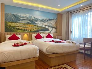 Letto o letti in una camera di Hotel Malati