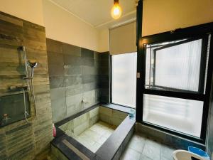 Koupelna v ubytování Chiuan Jia Hot Spring House + 25 fotografií