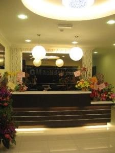a flower shop with stairs and flowers in it at GM Holiday Hotel in Lumut