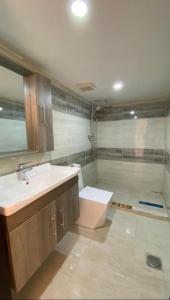 a bathroom with a sink and a shower at Wadi rum sky luxury in Wadi Rum +43 photos