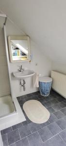 a bathroom with a sink and a toilet at Landhaus auf der Alm 