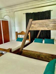 Postel nebo postele na pokoji v ubytování Casa Hotel Impacto