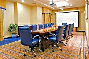 a conference room with a long table and chairs at Holiday Inn Express & Suites Riverport Richmond, an IHG Hotel in Richmond