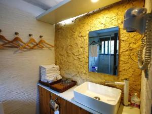 Koupelna v ubytování Tulou Herongzhuang Inn + 32 fotografií