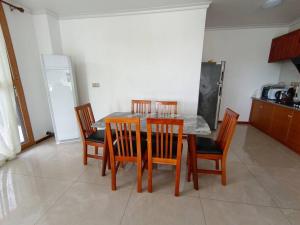 a dining room with a table and four chairs at Exquisite 3-Bedroom Unit With Free Parking. in Nadi