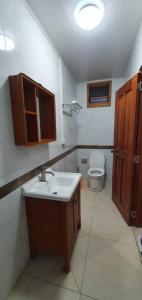 a bathroom with a sink and a toilet at Exquisite 3-Bedroom Unit With Free Parking. in Nadi