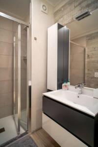 a bathroom with a sink and a shower at Stylish three rooms in Cervinia 82 in Breuil-Cervinia